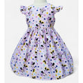 Children's dress with Minnie Mouse pattern on a white background