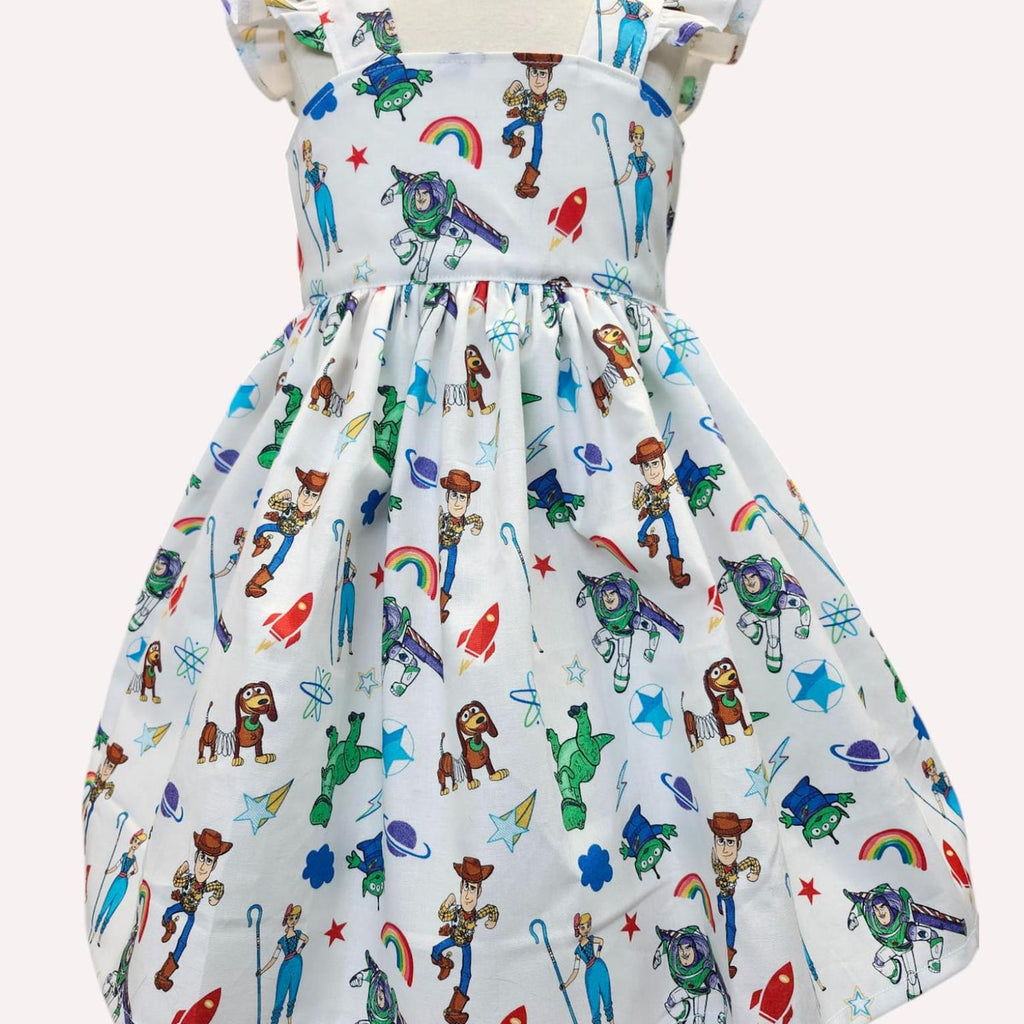 Children's dress with Toy Story character print on a white background