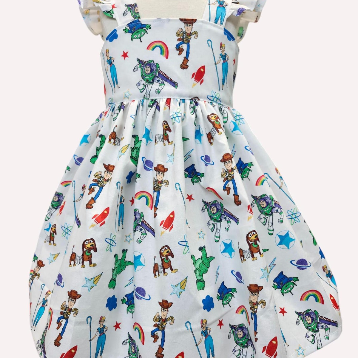Children's dress with Toy Story character print on a white background