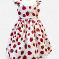Children's dress with strawberry pattern on a white background