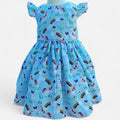 Children's dress with rainbow and unicorn pattern on a light blue background