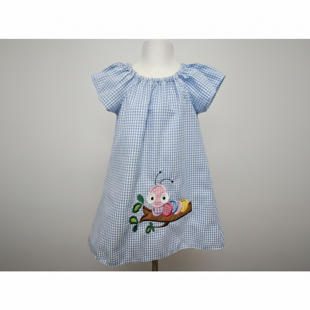 Blue checkered dress with embroidered design on a white background