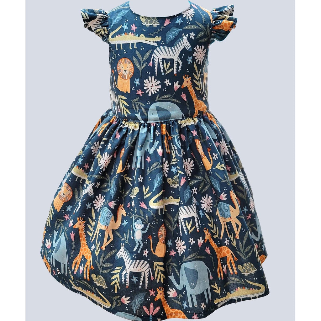 Children's dress with animal pattern on a light gray background