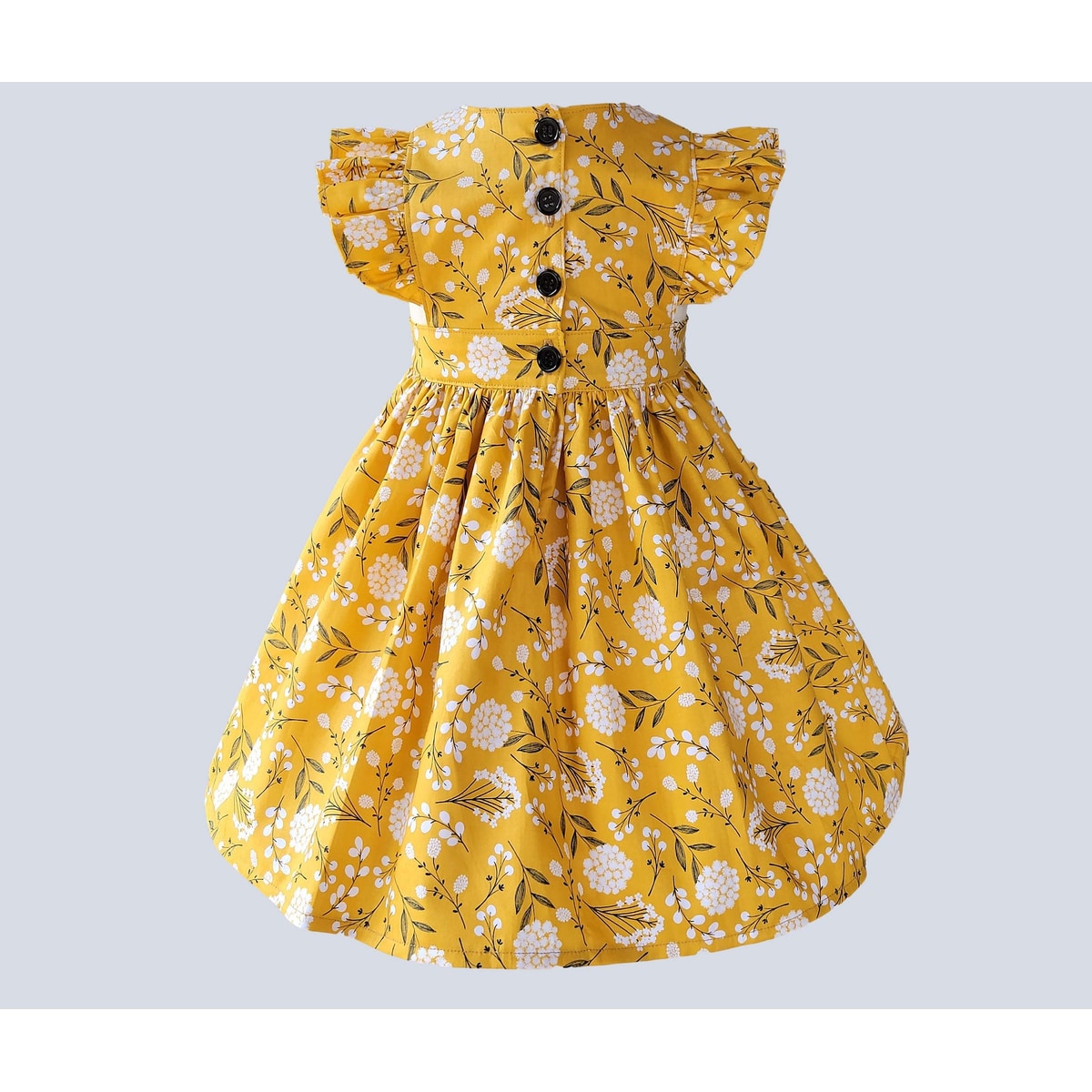 Yellow floral dress with black details on a light gray background