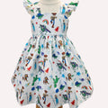 Children's dress with colorful cartoon character print on a white background