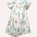 Dress with Paris-themed print featuring Eiffel Tower and hot air balloons on a white background