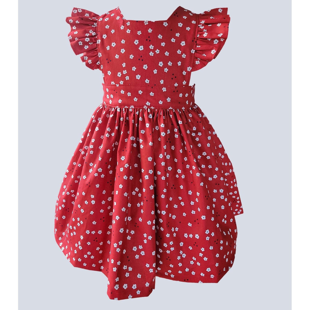 Red dress with white floral pattern on a light gray background