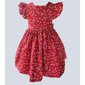 Red dress with white floral pattern on a light gray background
