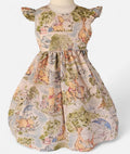 Children's dress with Winnie the Pooh pattern on a mannequin against a white background