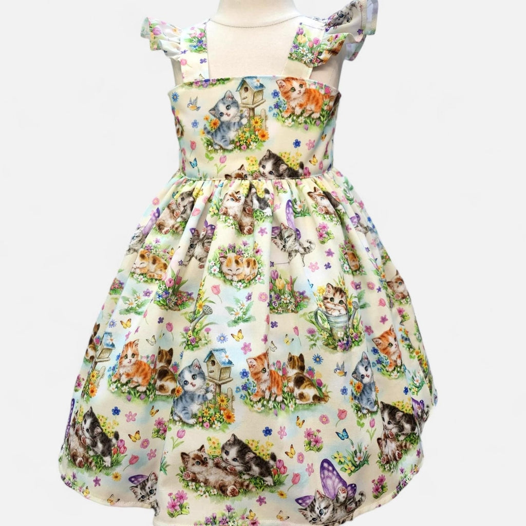Dress with cat and flower pattern on a white background