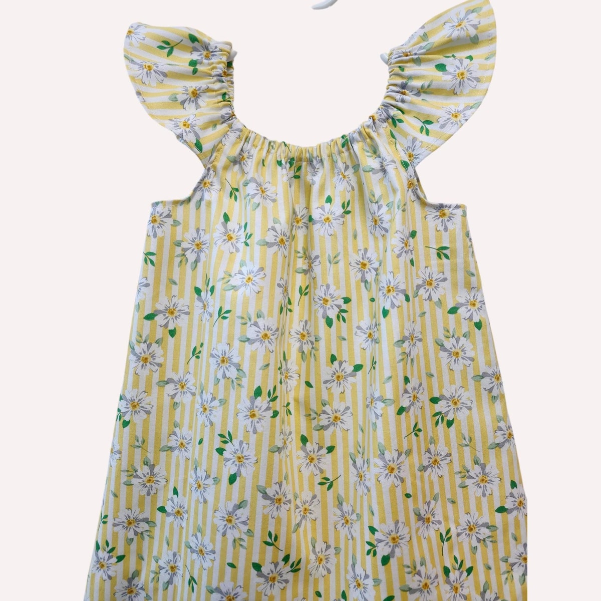 Yellow floral dress with ruffled sleeves on a white background