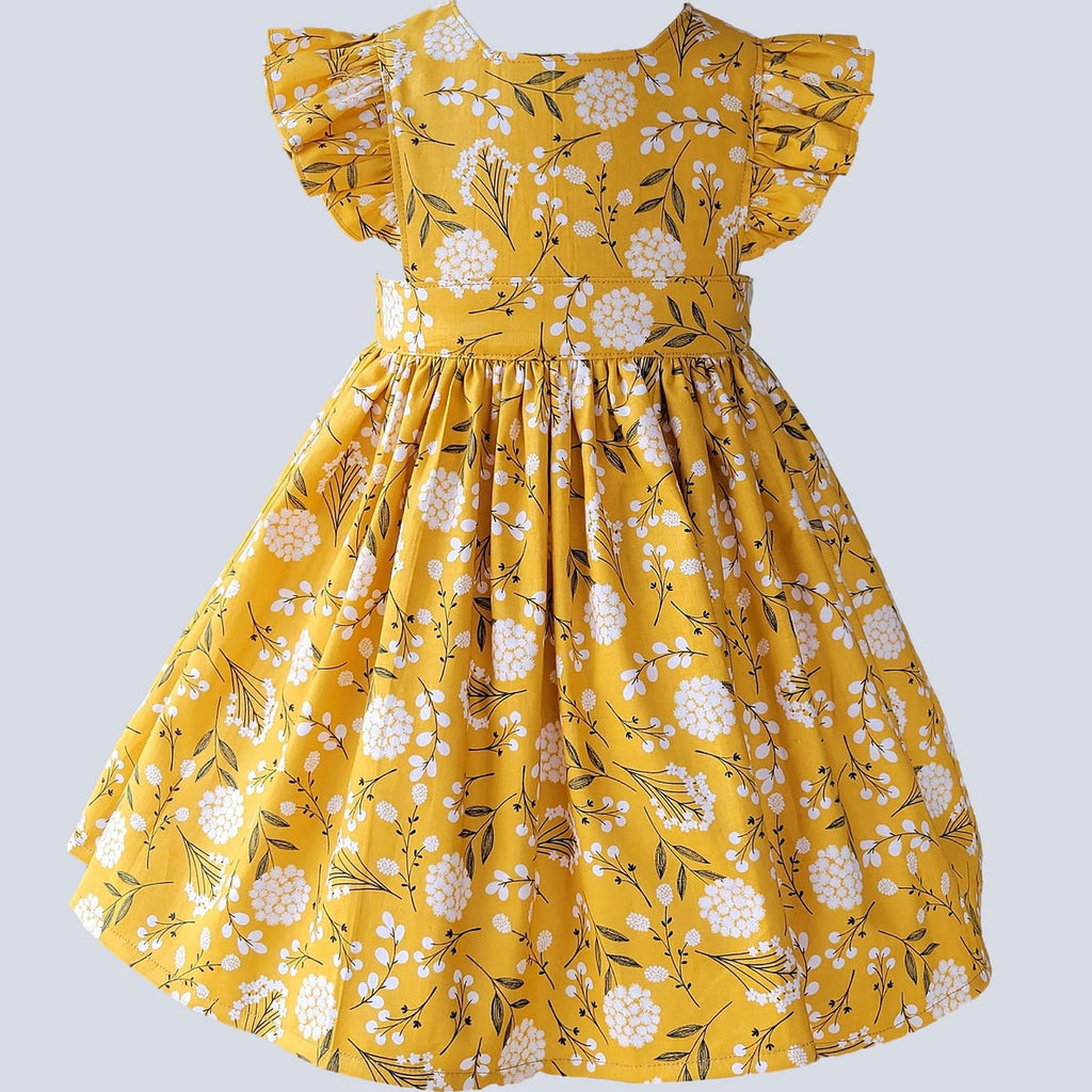 Yellow floral dress on a light gray background