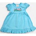 Light blue dress with floral embroidery on a white background