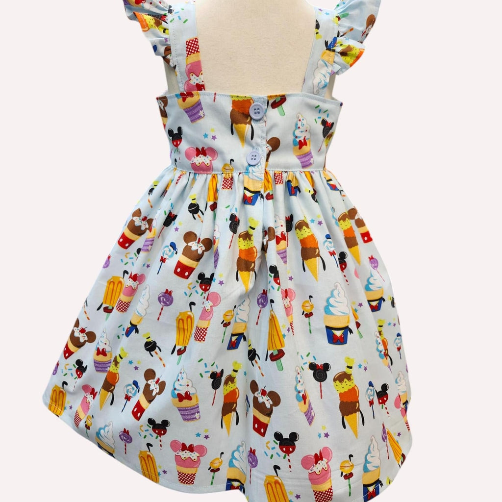 Children's dress with colorful ice cream cone pattern on a white background
