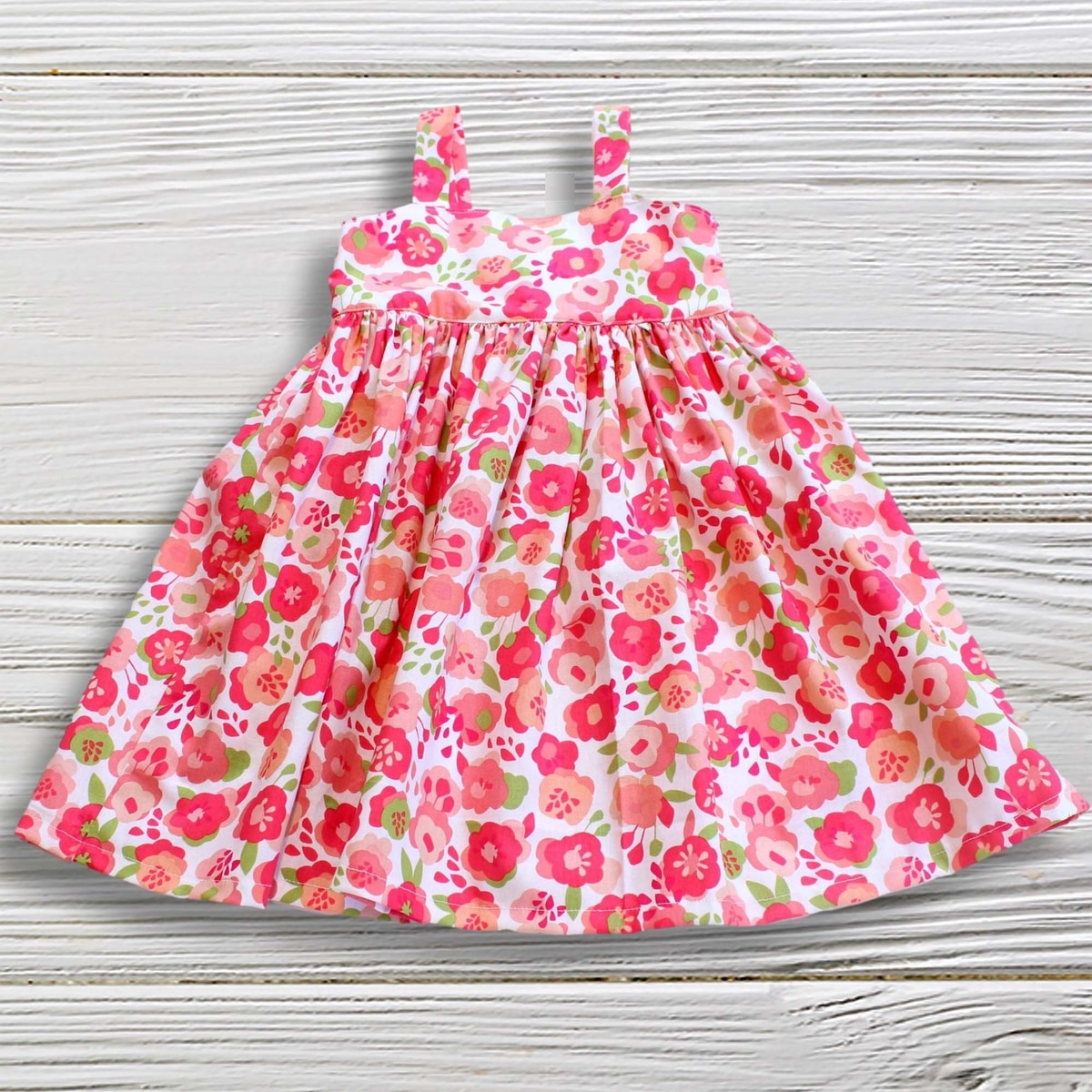 Floral dress on a wooden surface