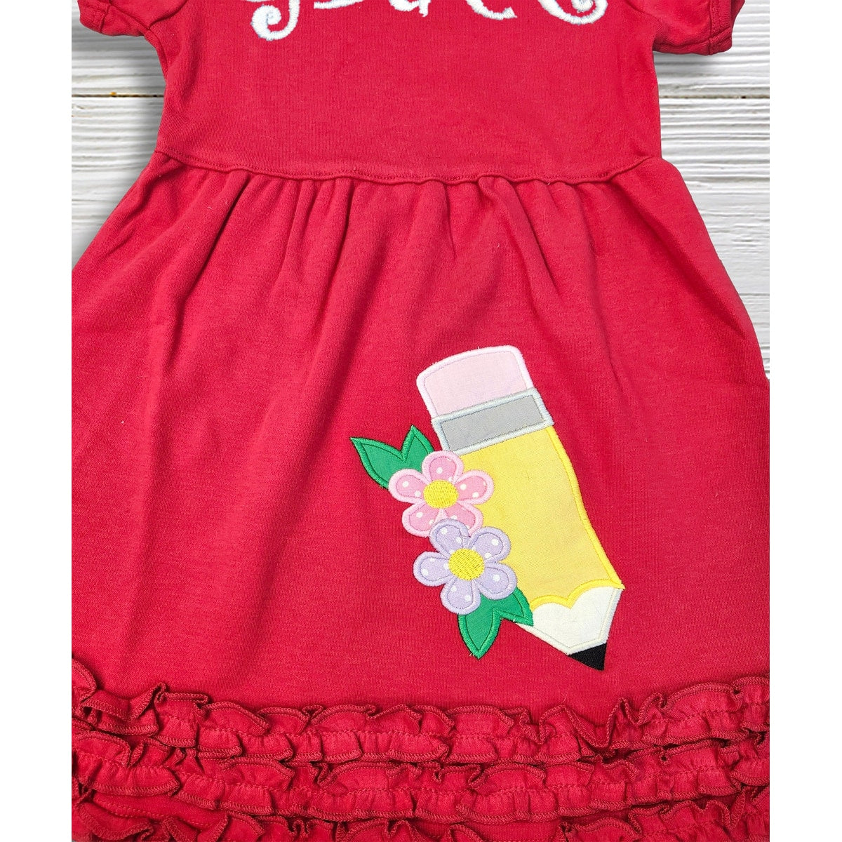 Red dress with a pencil and flower design on a white background