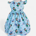 Children's dress with cartoon character print on a light blue background