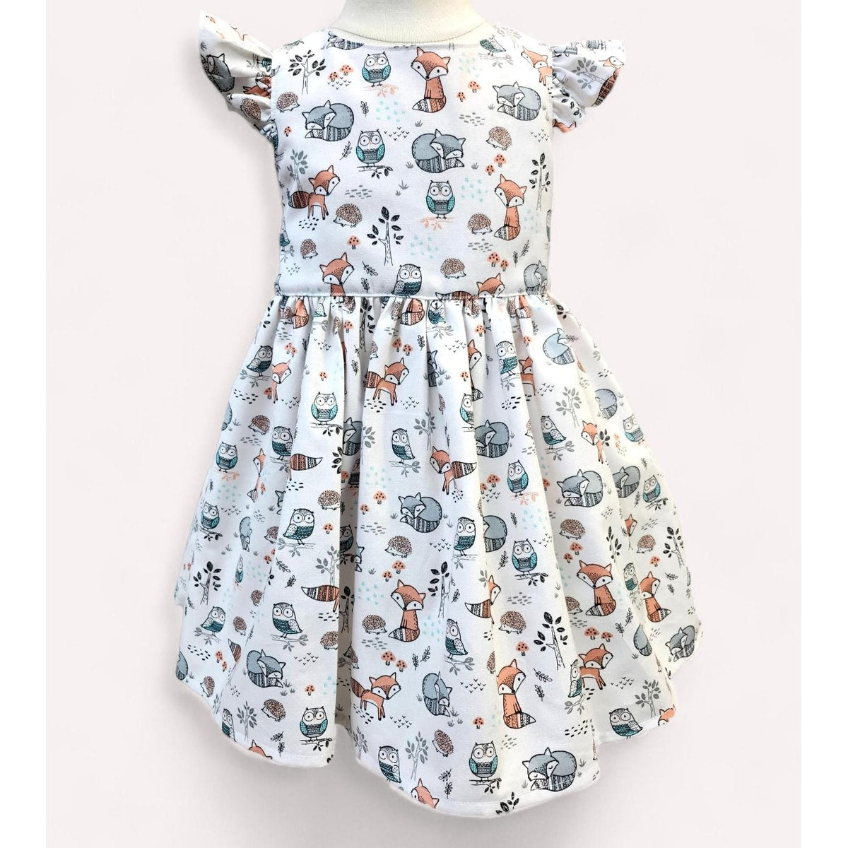 Children's dress with animal pattern on a white background