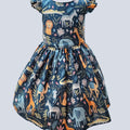 Children's dress with animal pattern on a light gray background