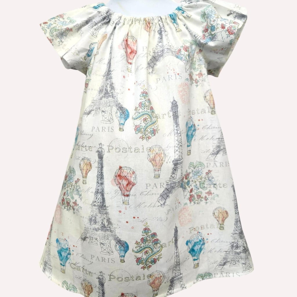 Dress with Eiffel Tower and hot air balloon print on a white background