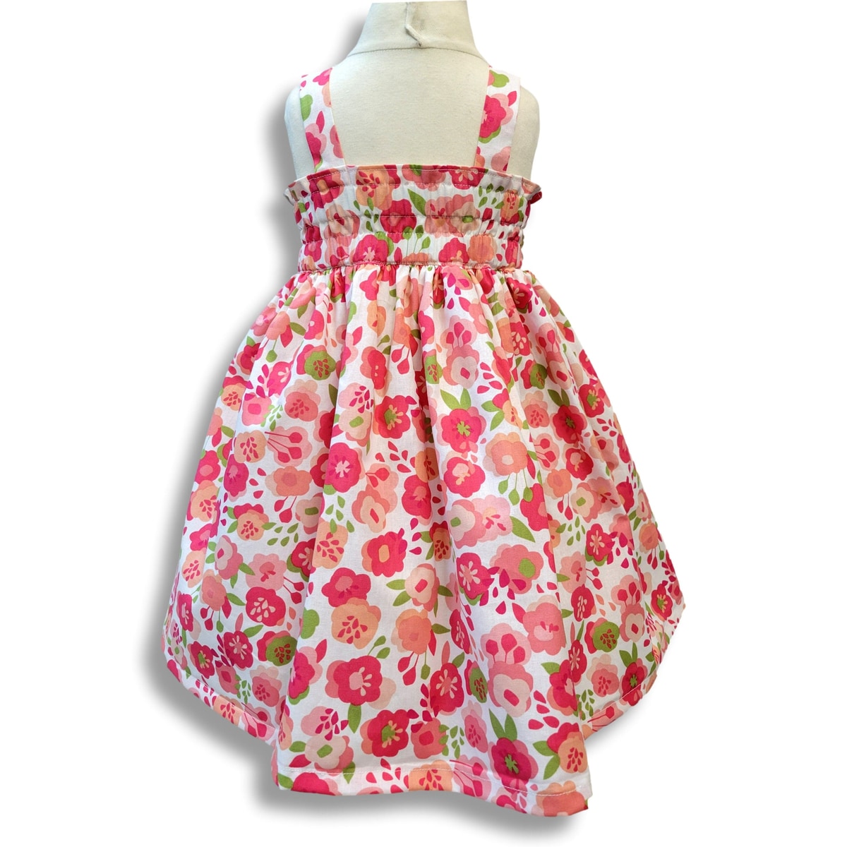Floral dress with pink and green flowers on a white background