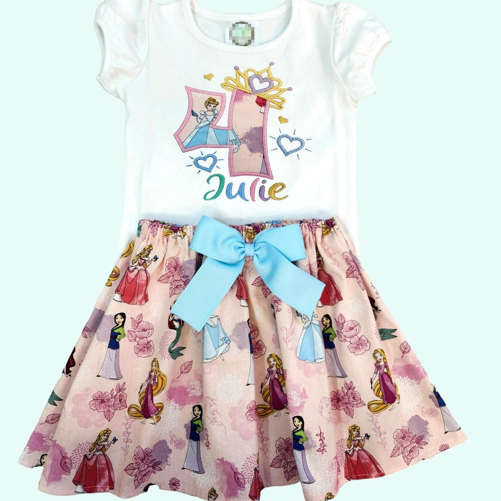 Children's dress with princess design and name 'Julie' on a white background