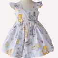 Children's dress with cartoon character print on a mannequin against a white background