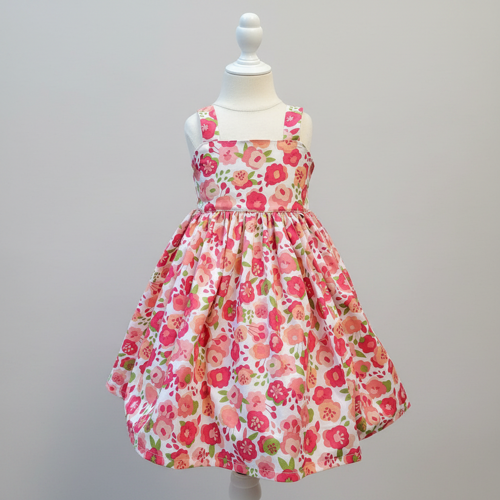 Floral dress on a mannequin against a gray background