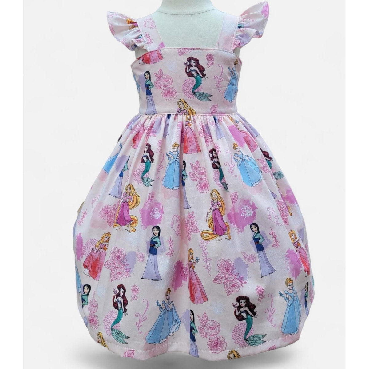 Children's dress with princesses and flowers on a white background