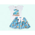 Children's outfit with a white top and blue skirt featuring cartoon characters on a light blue background.