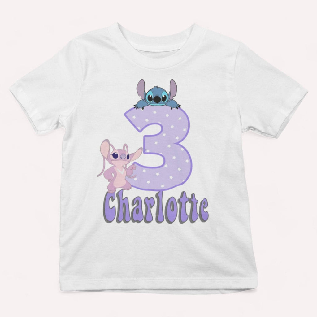 White t-shirt with cartoon characters and the number 3 on a white background