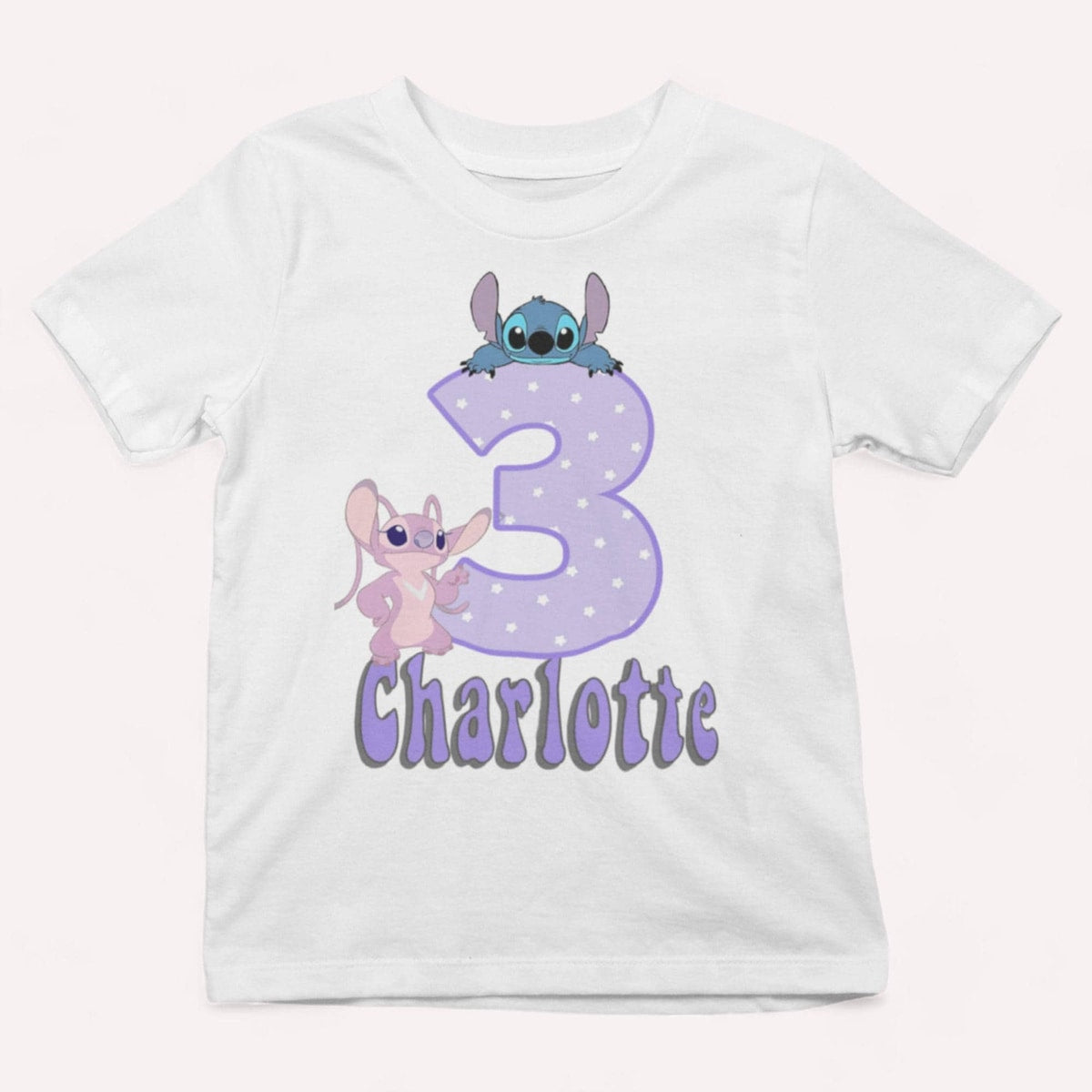 White t-shirt with cartoon characters and the number 3 on a white background