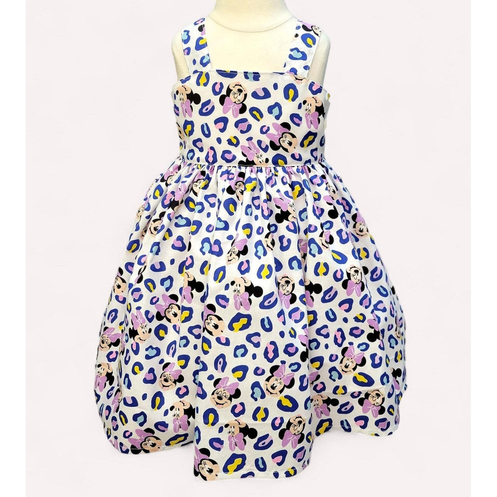 Dress with Minnie Mouse pattern on a white background