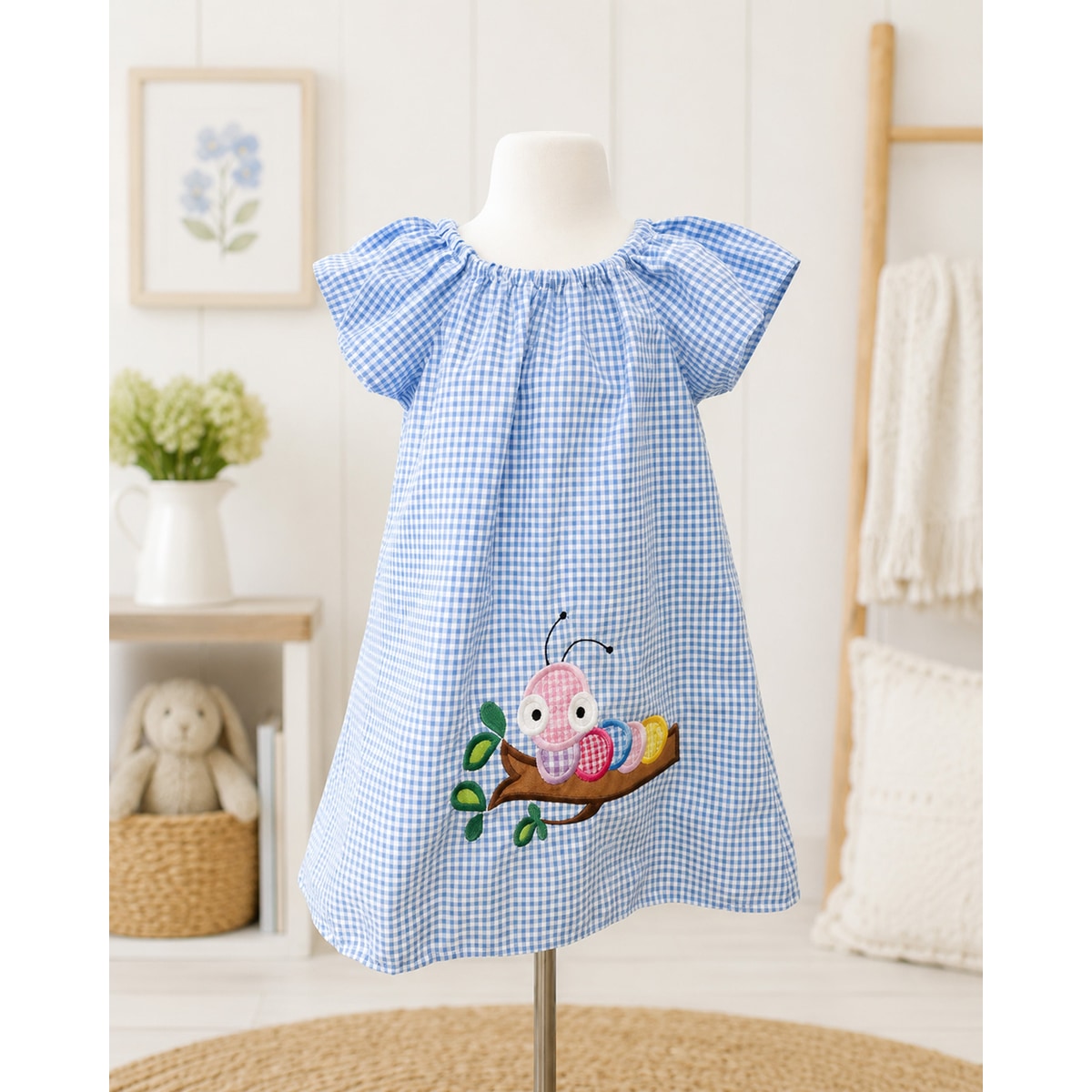 Blue checkered dress with a pink butterfly design on a mannequin against a white wall.