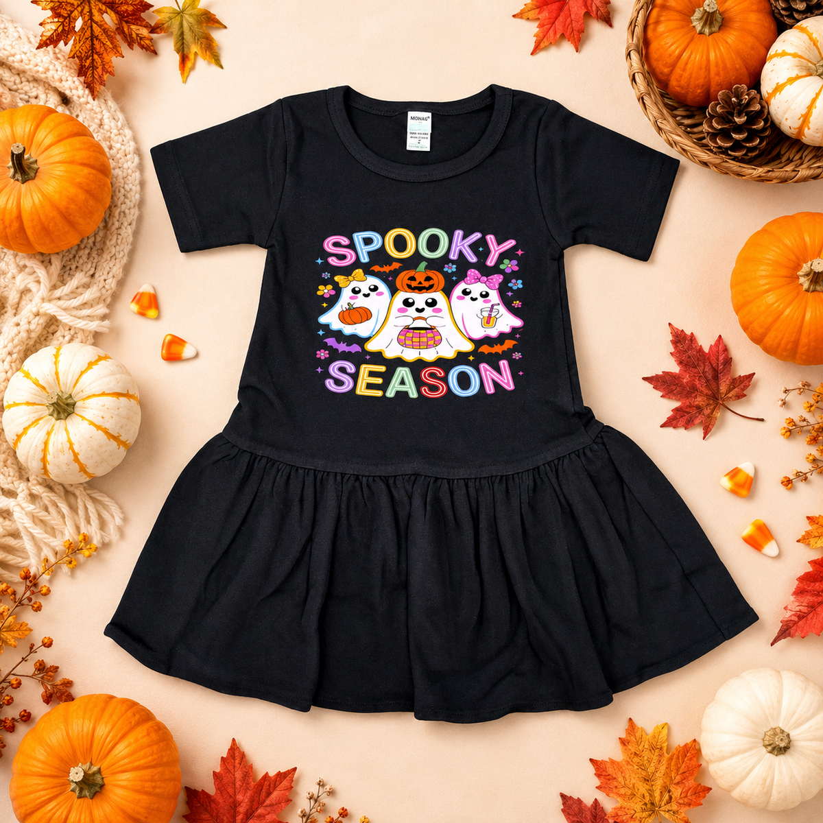 Black dress with 'Spooky Season' text and cartoon ghosts on a Halloween-themed background with pumpkins and leaves.