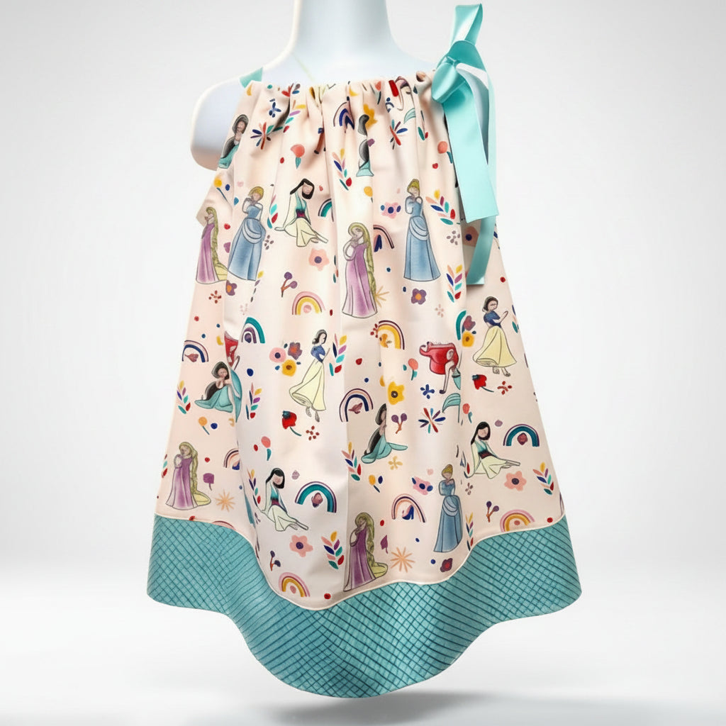 Children's dress with princess pattern on a mannequin against a pink background