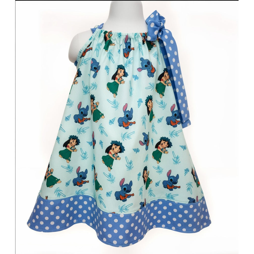 Children's dress with cartoon character print on a white background