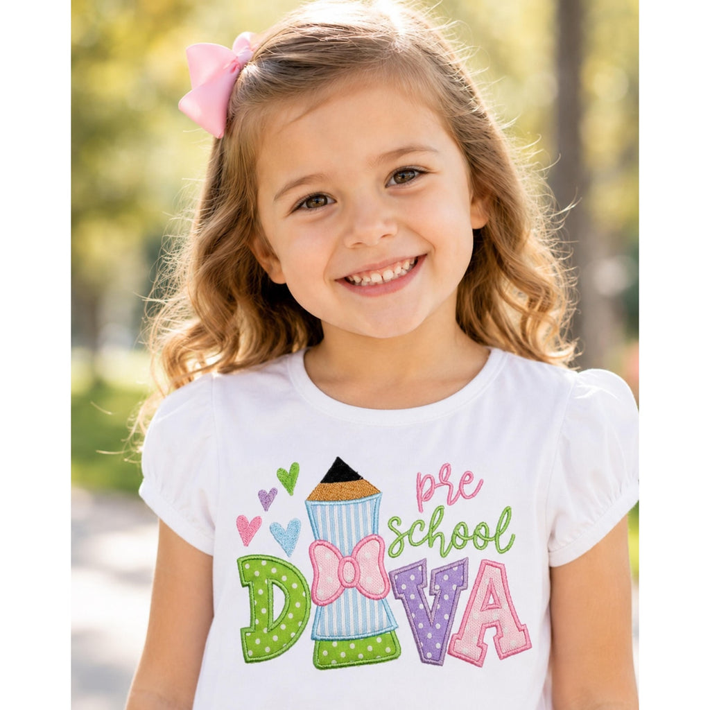 Young girl wearing a 'pre school DIVA' shirt outdoors